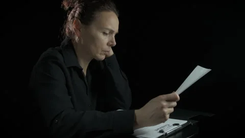 Female read contract on black background Stock Footage 325080234