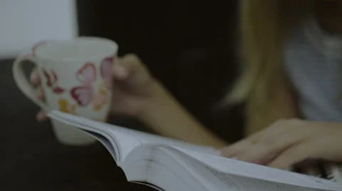 Female reading and drinking cofee Stock Footage 54937929
