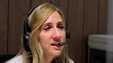 Female receptionist talking on headset Stock Footage 262997149