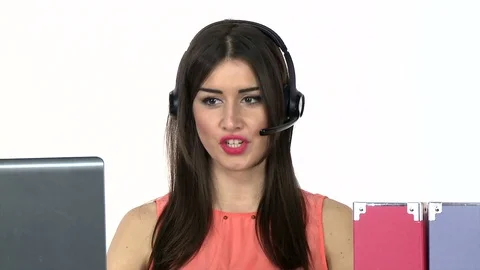 Female receptionist working on computer and talking on the telephone Stockbeeldmateriaal 79394410
