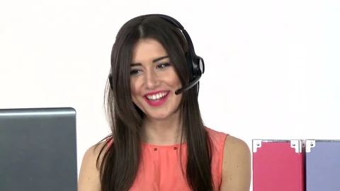 Female receptionist working on computer and talking on the telephone in call cen Stockbeeldmateriaal 79397741