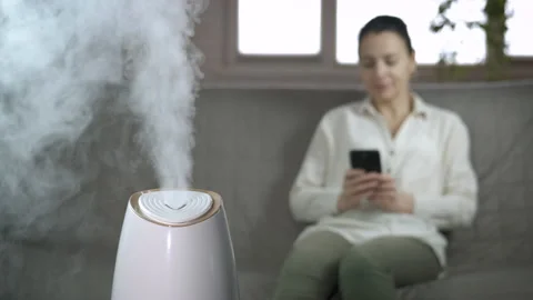 Female relax by aroma diffuser in room. Stock Footage 196672101
