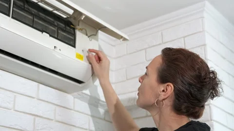 Female remove the dust filter from conditioner. Video stock 307908869