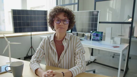 Female Renewable Energy Developer Speaking on Camera in Office Video stock 230102464