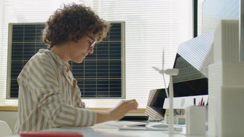 Female Renewable Energy Developer Using Tablet and Computer in Office Video stock 230103246