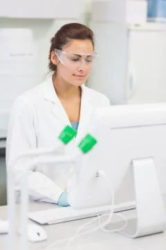 Female researcher using a computer in the lab 스톡 사진