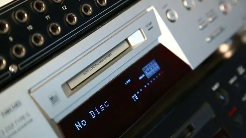The female right hand presses the eject mini disc recorder button Stock Footage 77201009