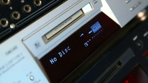 The female right hand presses the eject mini disc recorder button. it is come Stock Footage 78776563