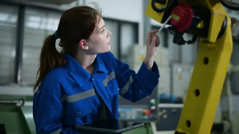 Female Robotics engineer working with Programming and Manipulating Robot Hand Stock Footage 280791198