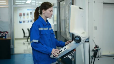 Female Robotics engineers Using Controller to Remotely Operate programming Stock Footage 280791120