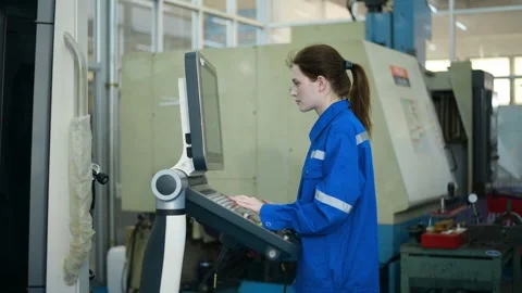 Female Robotics engineers Using Controller to Remotely Operate programming Stock Footage 280791127