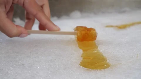 Female Rolling Maple Syrup Towards Camera Video stock 252600187