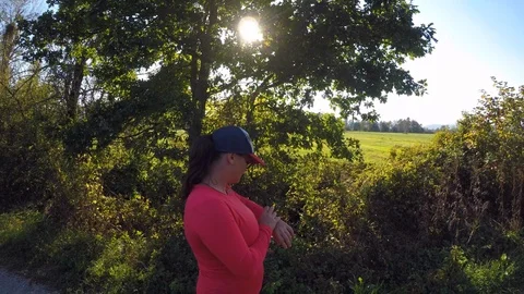 Female runner checking her pulse on smart watch Stock Footage 95497934
