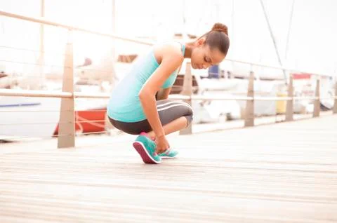 Female runner checking her shoe Stock Photos