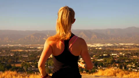 Female Runner Checking Watch with 360 Pan 4K Stock Footage 159514182