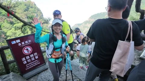 Female Runner Greeting Camera on Crowded Mountain Stone Steps, Lushan Stock-Footage 346718081