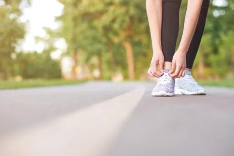 Female runner jogging in the forest Stock Photos