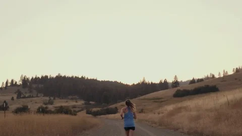 Female runner running at dusk Stock Footage 78674180