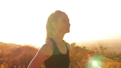 Female Runner Standing at Sunset Stock Footage 159515130