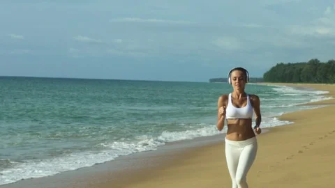Female Runner Training On Beautiful Beach Stock Footage 70572715