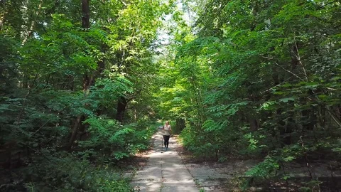 Female running in park Stock Footage 93748010