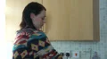 Female rushing around in kitchen making tea HD Footage