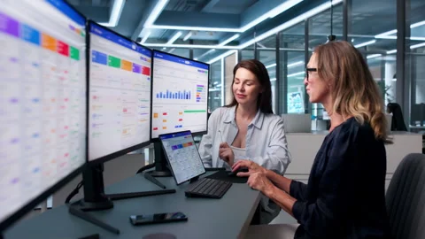 Female Sales Manager Studies Client Data On Computer Stock Footage 341006999