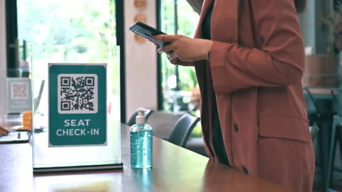 Female scan check-in QR code by smartphone app in restaurant Video stock 147401148