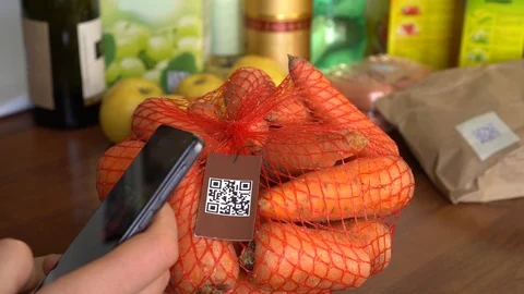 A female scans a QR code on product packaging Stock Footage 103074862