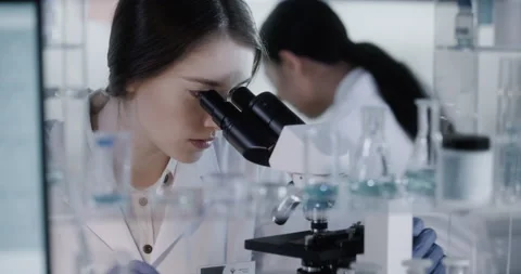 Female science team working in laboratory. Studying medical samples Stock Footage 133520057