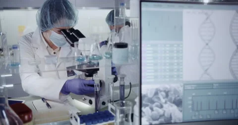Female science team working in laboratory. Studying DNA samples Stock Footage 133530208