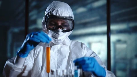 Female scientist analyzing samples in test tube. Medical Scientist work on a new Stock-Footage 95090380