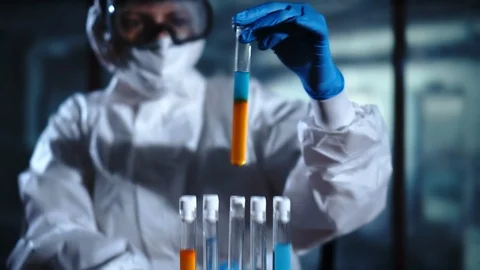 Female scientist analyzing samples in test tube in the Laboratory. New chemicals Stock Footage 95090978