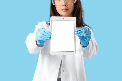 Female scientist with blank tablet computer on blue background, closeup Stock Photos