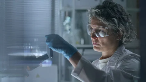 Female Scientist Blood Sample in Test Tube and Taking Notes in Laboratory Stock Footage 291255710
