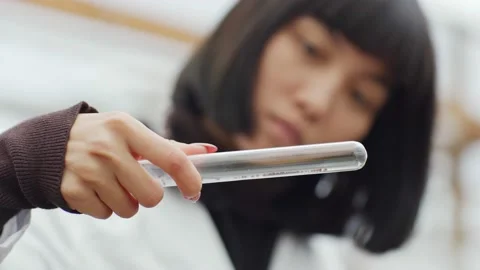 Female scientist examining soil sample in test tube Stock Footage 142406412