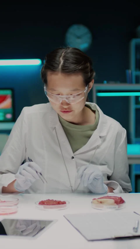 Female Scientist Explaining Process of Cultivating Lab-Grown Meat on Camera Stock Footage 288803317