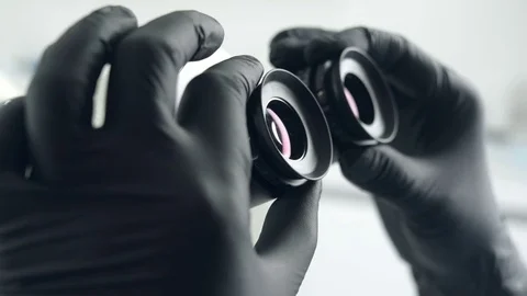 Female scientist looking microscope eyepiece. Close-up Stock Footage 74445114