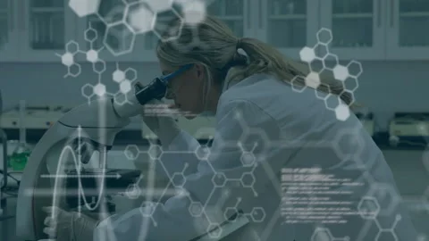Female scientist placing slide on microscope causing hexagon code overlays and Stock Footage 312842414