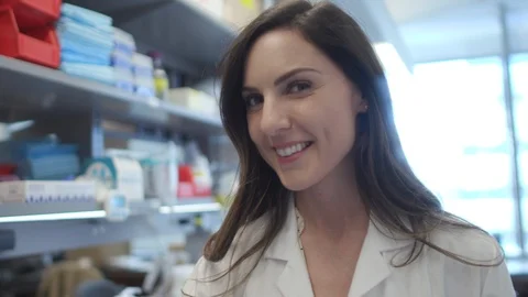 Female Scientist Posing In Lab Video stock 122937130