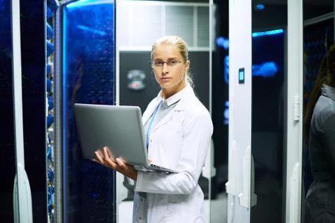 Female Scientist Posing with Supercomputer Foto stock