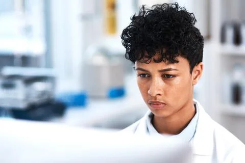Female scientist, thinking and computer in lab for research, clinical trial or Foto stock