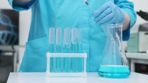 Female scientist using a micropipette for analysis in a modern laboratory. Stock Footage 269281565