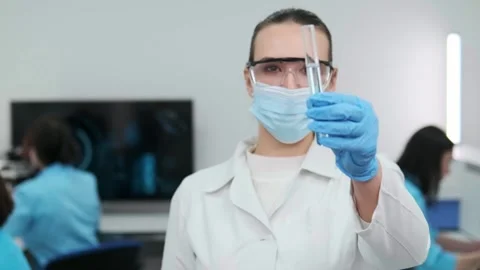 Female scientist using a micropipette for analysis in a modern laboratory. 動画素材 269282329