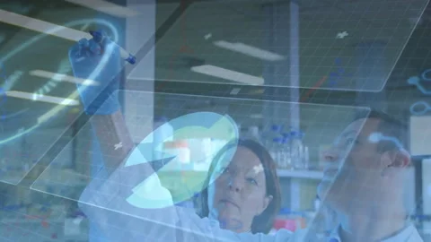 Female scientist using stylus manipulating holographic disk for data analysis in Stock Footage 312468001