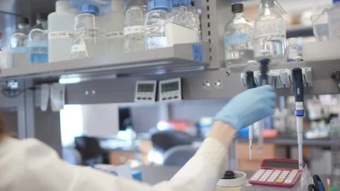 Female Scientist Working In Lab Video stock 122935482