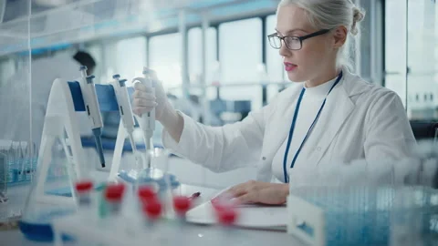 Female Scientist Working in Laboratory Stock Footage 143739587