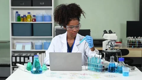 Female scientist working with micro pipettes analyzing biochemical samples,.. Stock Footage 313706033
