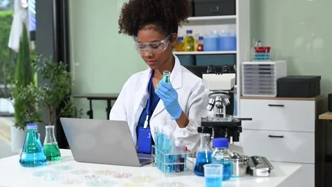Female scientist working with micro pipettes analyzing biochemical samples,.. Stock Footage 313706044
