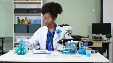Female scientist working with micro pipettes analyzing biochemical samples,.. Stock Footage 313706080